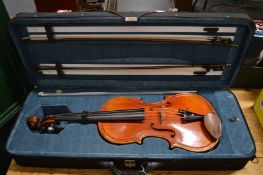 A good modern viola, cased with accessories.