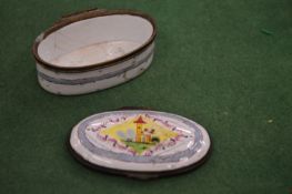 An enamel oval pill box (af).
