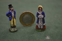 Two miniature porcelain figures.