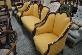 An Edwardian mahogany framed three piece upholstered suite.