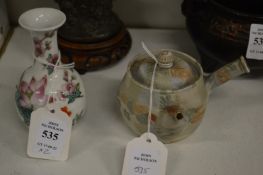 A miniature Chinese bottle vase and an unusual tea pot.