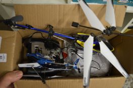 Two small remote-control helicopters.