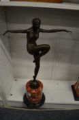 An art deco style bronze figure of a dancer on a marble base.