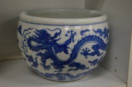 A Chinese blue and white bowl decorated with dragons.