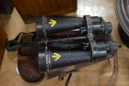 A cased pair of military binoculars.