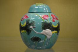 A turquoise ground ginger jar and cover.