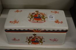 An armorial porcelain box and cover.