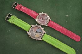 Two oversized wristwatches.