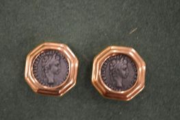 A pair of decorative ear clips.