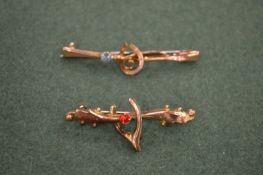 Two 9 carat gold brooches.