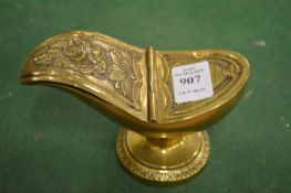 A small cast brass spoon warmer.