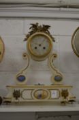 An ornate alabaster mantel clock.