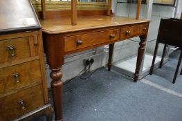 A Victorian mahogany two drawer side table.