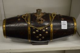 A brass bound barrel shaped powder flask.