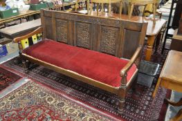 A large oak settle.