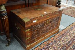 An Eastern brass inlaid carved hardwood coffer.