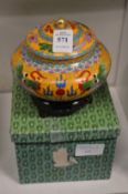 A cloisonne bowl and cover with wooden stand and original box.