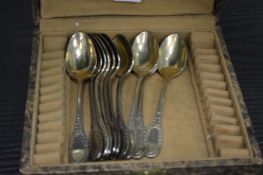 A set of eleven silver plated coffee spoons.