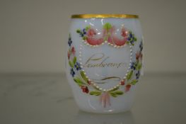 An enamelled Milch glass mug.