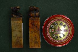 A small pair of Chinese soapstone seals and a tin of ink.