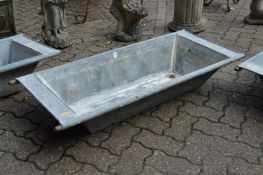 A galvanised garden trough.