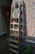 Two wooden step ladders.