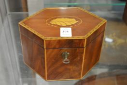 A Georgian style mahogany and satinwood tea caddy.