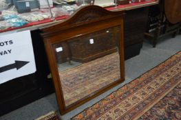 A mahogany framed mirror.