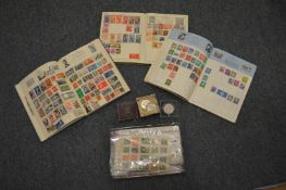 A quantity of stamps and coins.