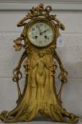 An Art Nouveau spelter mantel clock.