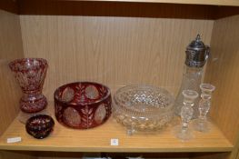 Cut glass bowls, a vase, a pair of candlestick and a claret jug.