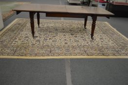 A large Persian design carpet, cream ground with stylised floral decoration 370cm x 275cm.