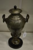 A pewter hot water urn.