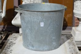 A galvanised twin handled planter.