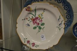 A 19th century French plate painted with flowers.