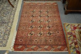 A small Bukhara rug, rust ground with three rows of five gulls 150cm x 97cm.
