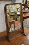 A walnut dressing table mirror.