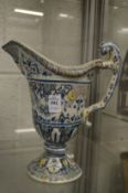 A continental Maiolica ewer (restored).