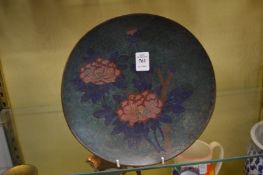 A cloisonne plate.