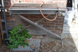 A Buffalo stainless steel professional barbeque.