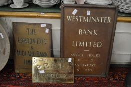 An old Westminster Bank sign and two others similar.