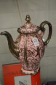 A Rosenthal Pompadour coffee pot.