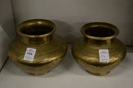 A pair of Indian engraved brass vases.