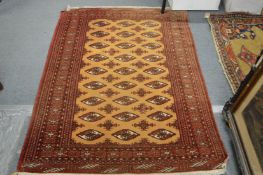 A modern Persian design Bukhara rug 170cm x 120cm.