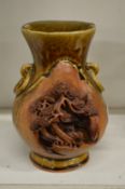 An unusual Chinese moulded glazed pottery vase.
