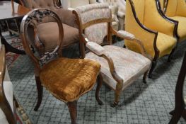A Victorian small rosewood framed armchair together with a dining chair.