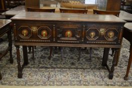 A small oak three drawer dresser.