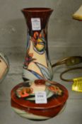 A modern Moorcroft circular bowl and cover and similar vase (vase chipped).