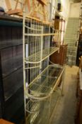 A good large wrought iron and glass five tier display unit.