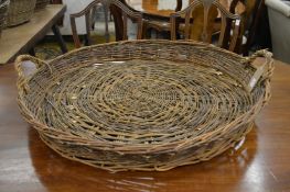 A wicker twin handled basket.